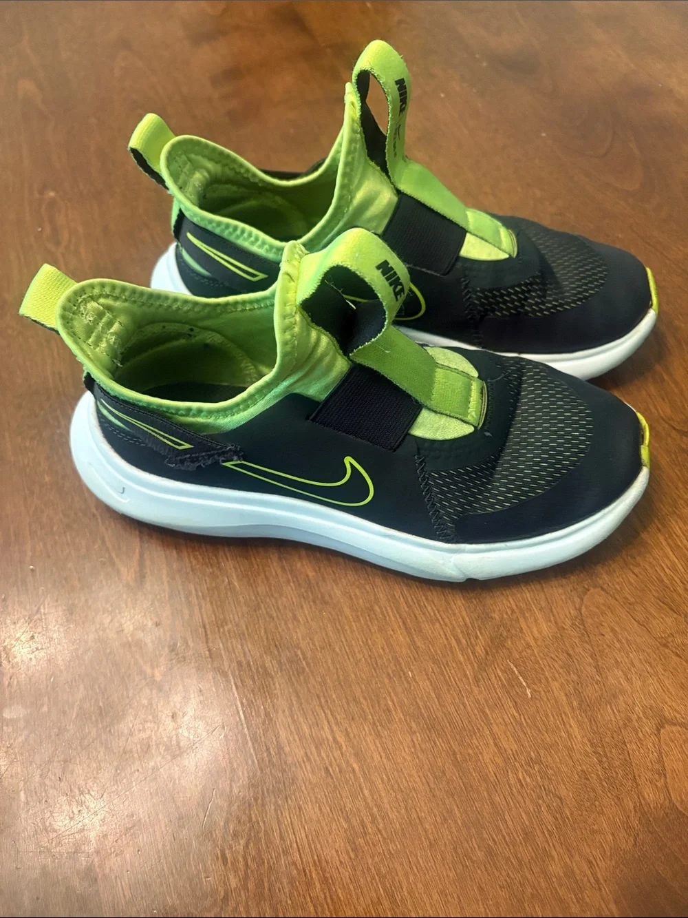 Nike Kids Slip-On Sneakers in Black and Neon Green